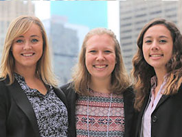 3 women in a city setting